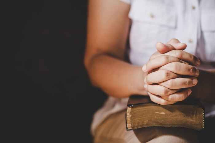 women praying with the bible
